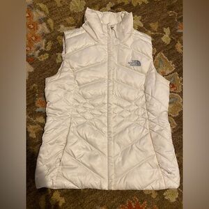 The North Face white high collar puffer vest. Size extra small.